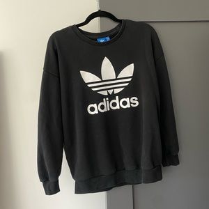 Likely worn black Adidas sweater! Not the stiff kind.